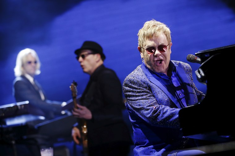 British singer Elton John (R) performs at the \"All The Hits Tour\" concert in Hong Kong, China, Nov. 24, 2015. (Photo by Tyrone Siu/Reuters)