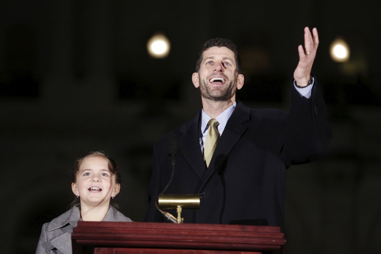 U.S. House Speaker Paul Ryan (R-WI) and Anna DeBolld, 10, from Soldotna, Alaska, light the Christmas Tree on Capitol Hill in Washington Dec. 2, 2015. (Photo by Joshua Roberts/Reuters)