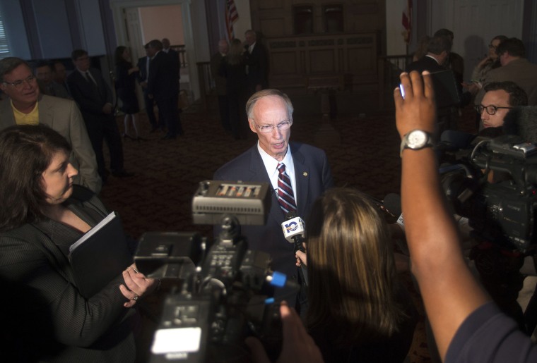 Alabama Gov. Robert Bentley speaks to the media after announcing a state settlement with BP for the 2010 oil spill in the Gulf of Mexico, July 2, 2015, at the Capitol building in Montgomery, Ala. (Photo by Albert Cesare/The Montgomery Advertiser/AP)
