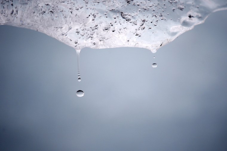 Droplets of water fall from a melting ice block harvested from Greenland and installed on Place du Pantheon in Paris, France, Dec. 3, 2015 as the World Climate Change Conference 2015 (COP21) continues. (Photo by Benoit Tessier/Reuters)