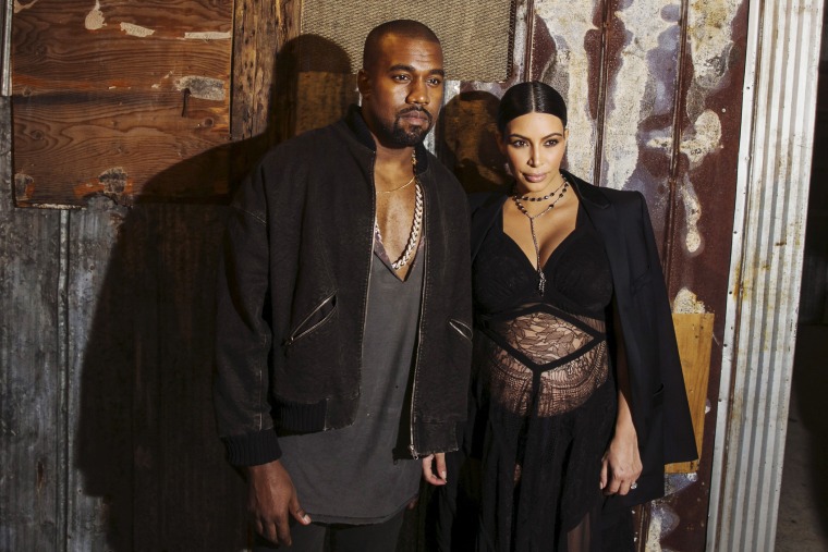 Musician Kanye West stands with his wife Kim Kardashian after watching the Givenchy Spring/Summer 2016 collection during New York Fashion Week, Sep. 11, 2015. (Photo by Lucas Jackson/Reuters)