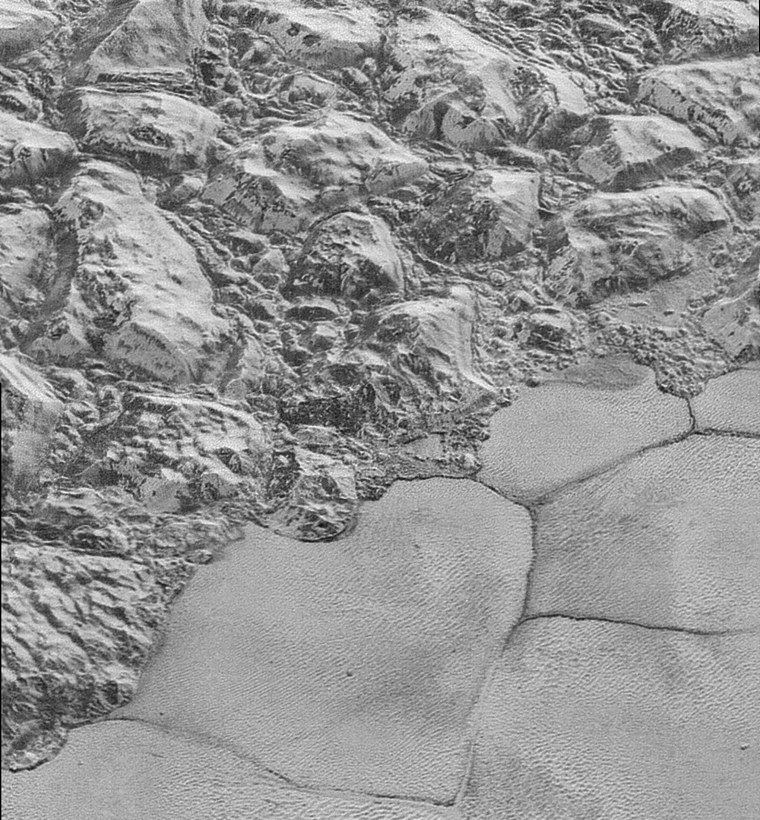 The Mountainous Shoreline of Sputnik Planum, on Pluto. In this highest-resolution image from NASA’s New Horizons spacecraft, great blocks of Pluto’s water-ice crust appear jammed together in the al-Idrisi mountains. (Photo by NASA/JHUAPL/SwRI)