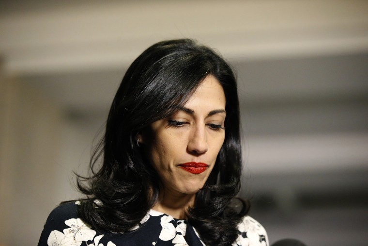 Huma Abedin, a longtime aide to Hillary Rodham Clinton, pauses while speaking to the media after testifying at a closed-door hearing of the House Benghazi Committee, on Capitol Hill, Oct. 16, 2015 in Washington, D.C. (Photo by Alex Brandon/AP)