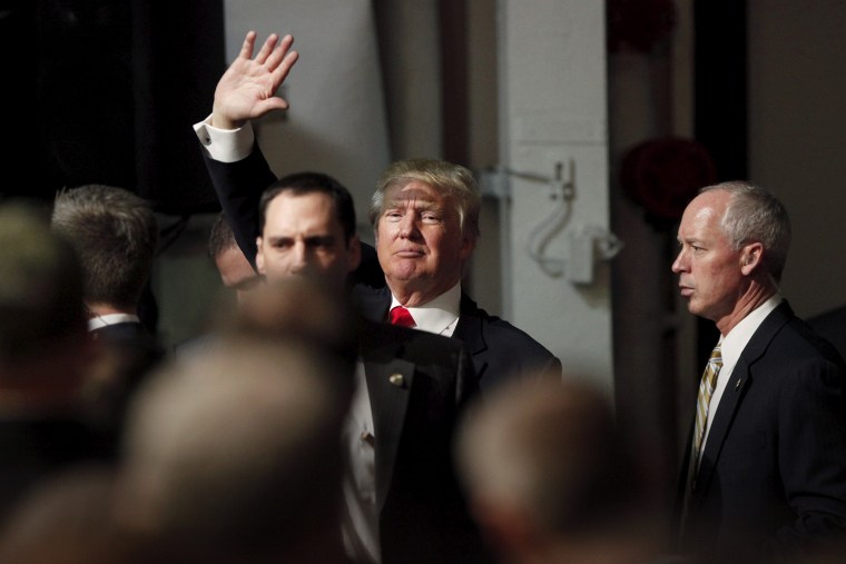 U.S. Republican presidential candidate Donald Trump waves to supporters after a Pearl Harbor Day rally aboard the USS Yorktown memorial in Mount Pleasant, S.C., Dec. 7, 2015. (Photo by Randall Hill/Reuters)
