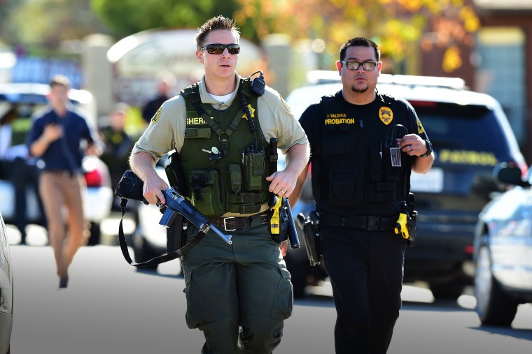 Police arrive at the scene of the mass shooting in San Bernardino, Calif. on Dec. 2, 2015. (Photo by Frederic J. Brown/AFP/Getty)
