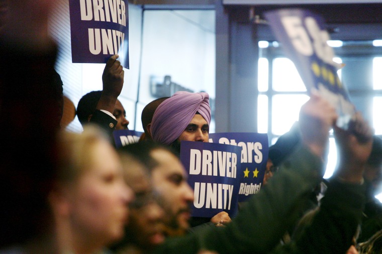 Supporters of ride share unionization are seen cheering after the Seattle City Council voted to approve drivers for Uber and Lyft to unionize, in Seattle, Wash., Dec. 14, 2015. (Photo by Matt McKnight/Reuters)