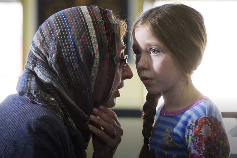 Ilhan Cagri of Silver Spring, and her granddaughter Sofia Blakenship, 8, attend the roundtable with Bernie Sanders at the Masjid Muhammad Mosque, Dec. 16, 2015. (Photo By Tom Williams/CQ Roll Call/Getty)