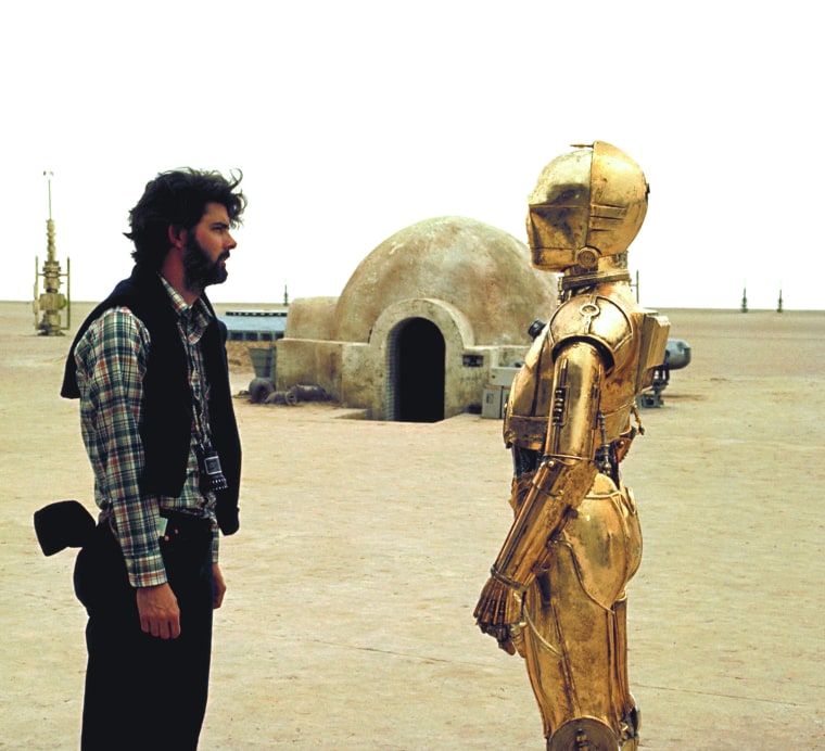 On the set of Star Wars: Episode IV, George Lucas and Anthony Daniels who plays C-3PO. (Photo courtesy of Lucasfilm/Corbis)