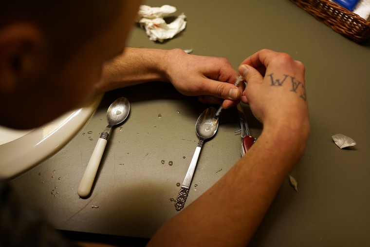 Drugs are prepared to shoot intravenously by a user addicted to heroin on Feb. 6, 2014 in St. Johnsbury, Vt. (Photo by Spencer Platt/Getty)