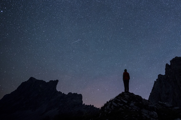 Stars and shooting stars are pictured during the annual Perseids meteor shower, with the 2827-meters Drusenfluh mountain (L) and the 2817-meters Sulzfluh mountain (R), in St. Antoenien in the canton of Grisons, Switzerland, on Aug. 13, 2015.