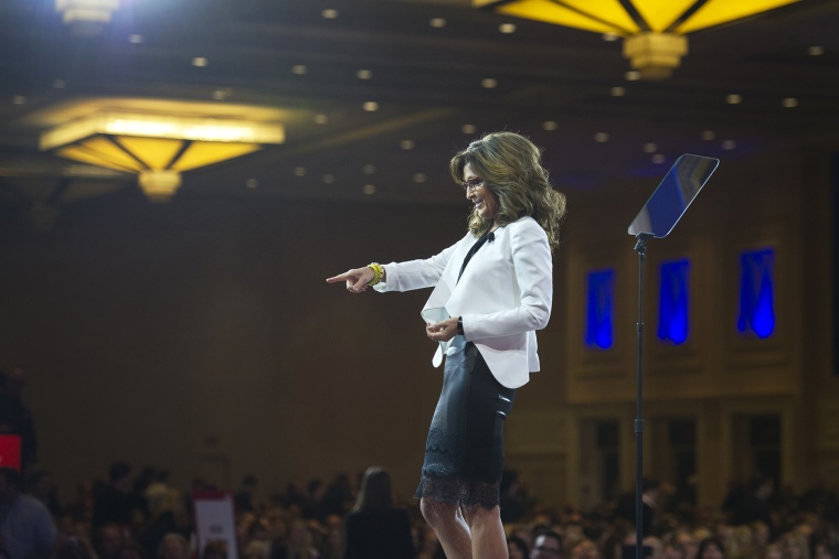 Former Alaska Gov. Sarah Palin points to an audience member while addressing the Conservative Political Action Conference (CPAC) in National Harbor, Md., Feb. 26, 2015. (Photo by Cliff Owen/AP)