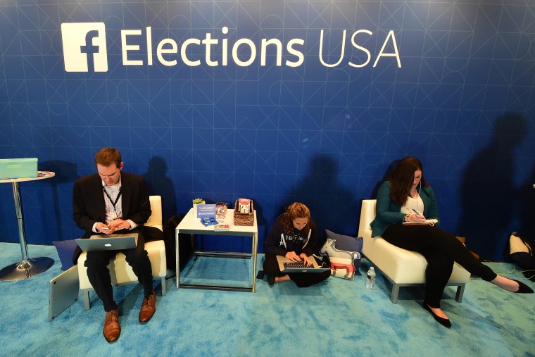 Journalists in the Facebook section take notes ahead of the Democratic presidential debate at the Wynn Hotel in Las Vegas, Nev., on Oct. 13, 2015, hours before the first Democratic Presidential Debate. (Photo by Frederick J. Brown/AFP/Getty)