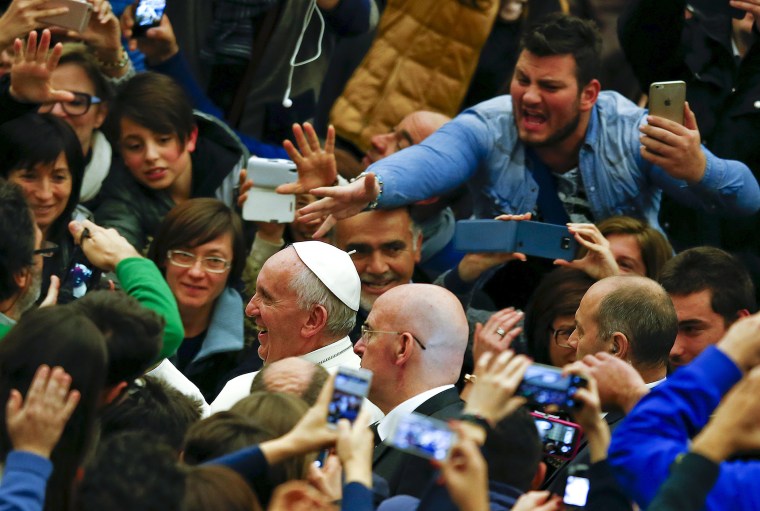 Pope Francis leaves at the end of a special audience with members of Italian episcopal conference (CEI) in Paul VI hall at the Vatican, Dec. 14, 2015. (Photo by Tony Gentile/Reuters)