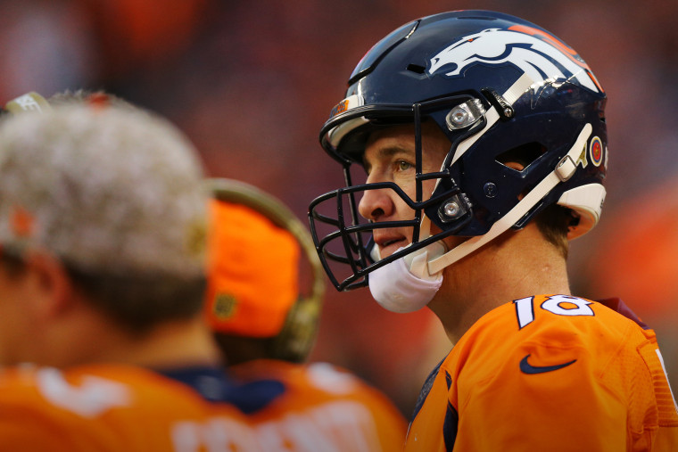 Quarterback Peyton Manning #18 of the Denver Broncos looks on from the bench at Sports Authority Field Field at Mile High on Nov. 15, 2015 in Denver, Colo. (Photo by Justin Edmonds/Getty)