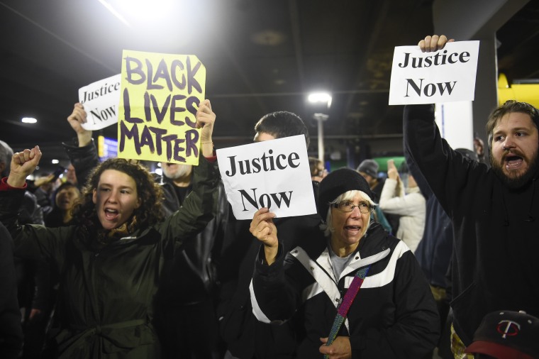 Black Lives Matter protesters chant slogans at the Mall of America light rail station in Bloomington