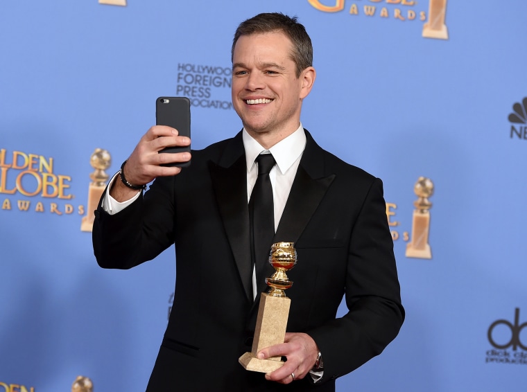 Matt Damon poses with the award for Best Performance by an Actor in a Motion Picture - Musical or Comedy for \"The Martian\" at the 73rd annual Golden Globe Awards, Jan. 10, 2016, at the Beverly Hilton Hotel. (Photo by Jordan Strauss/Invision/AP)