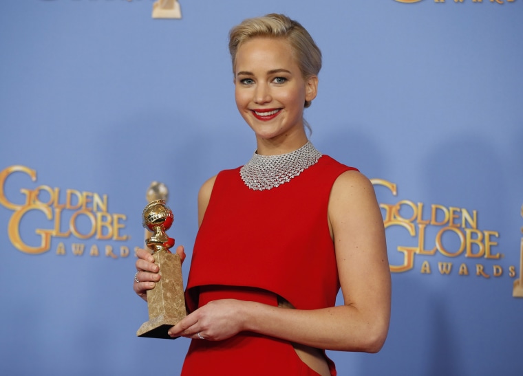 Jennifer Lawrence poses backstage with the award for Best Performance by an Actress in a Motion Picture - Musical or Comedy for her role in \"Joy\" at the 73rd Golden Globe Awards in Beverly Hills, Calif., Jan. 10, 2016. (Photo by Lucy Nicholson/Reuters)