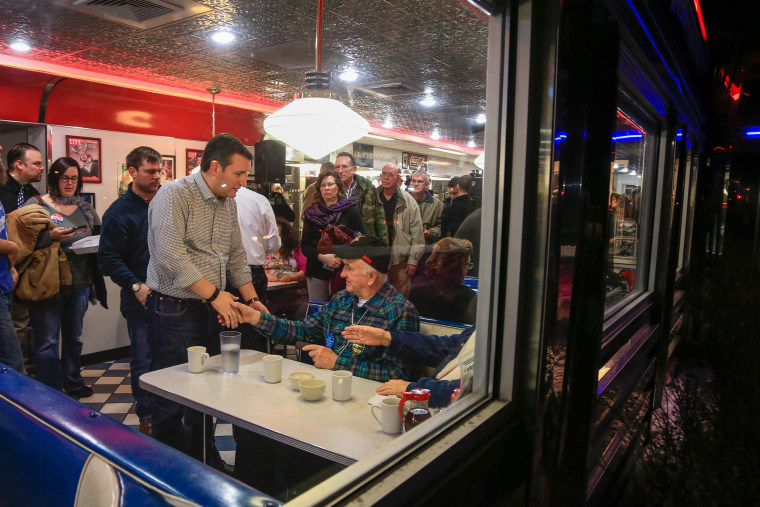 Republican Presidential candidate Sen. Ted Cruz, R-Texas, shakes the hand of Rex Haner, of Moorhead, Iowa, as he campaigns at Penny's Diner in Missouri Valley, Iowa, Jan. 4, 2016. (Photo by Nati Harnik/AP)
