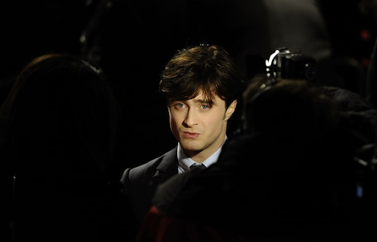 Britain's Daniel Radcliffe is seen posing as he arrives for the world premiere of \"Harry Potter and the Deathly Hallows: Part 1\" at Leicester Square in London, Nov. 11, 2010. (Photo by Dylan Martinez/Reuters)