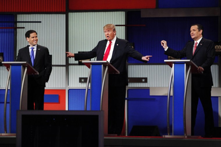 Presidential candidate Donald Trump gestures towards rivals Senator Marco Rubio and Senator Ted Cruz during the sixth Republican presidential candidates debate in North Charleston, S.C., Jan. 14, 2016. (Photo by Randall Hill/Reuters)
