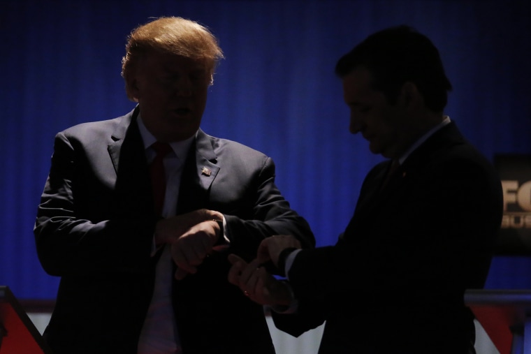 Republican U.S. presidential candidates Donald Trump and Senator Ted Cruz check their watches during a break at the sixth Republican presidential candidates debate in North Charleston, S.C., Jan. 14, 2016. (Photo by Chris Keane/Reuters)