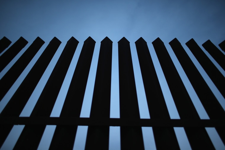 The U.S.-Mexico border fence stands on Dec. 8, 2015 near McAllen, Texas. (Photo by John Moore/Getty)