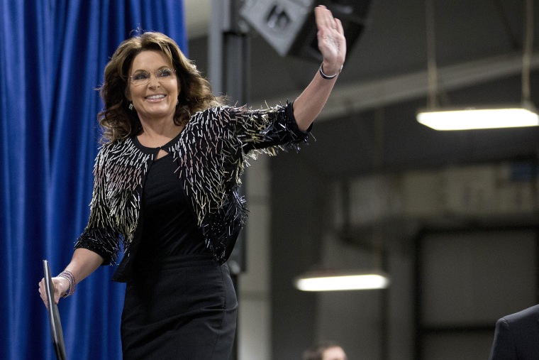 Former Alaska Gov. Sarah Palin waves as she arrives on stage to endorse Republican presidential candidate Donald Trump during a rally at the Iowa State University, Jan. 19, 2016, in Ames, Iowa. (Photo by Mary Altaffer/AP)