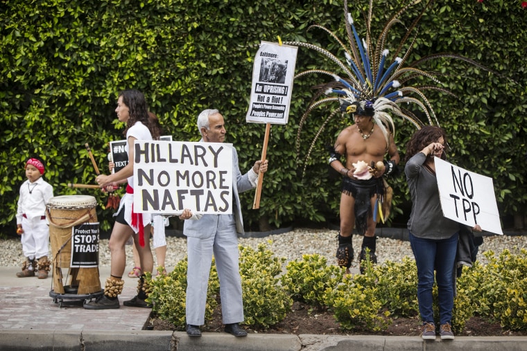 Los Angeles community members protest the Trans-Pacific Partnership (TPP) and Trade Promotion Authority (TPA) known as \"The Fast Track,\" in Beverly Hills, Calif., May 7, 2015. (Photo by Damian Dovarganes/AP)