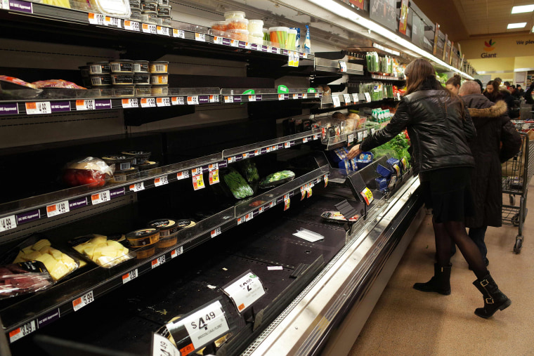 Near empty shelves are seen in the produce section at a supermarket on Jan. 21, 2016, ahead of an expected blizzard in Washington, D.C. (Photo by Mandel Ngan/AFP/Getty)