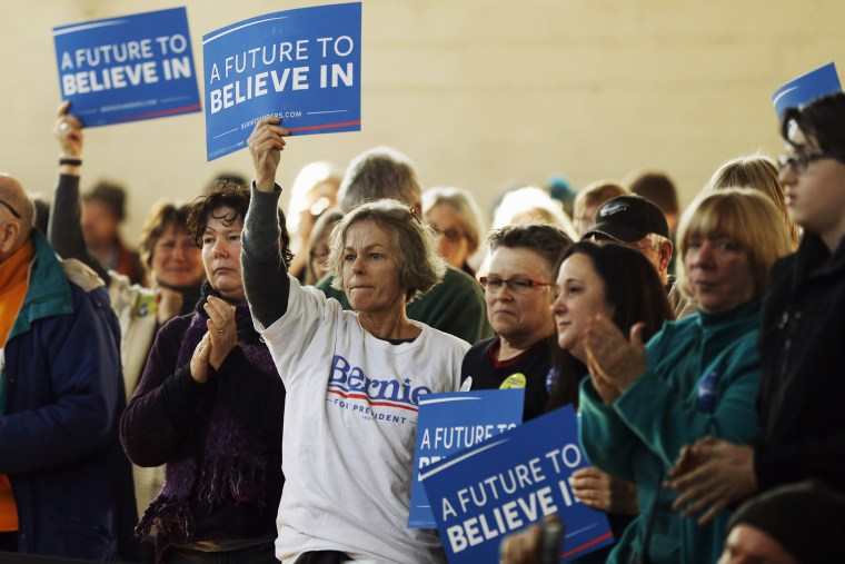 Attendees listen as Democratic presidential candidate, Sen. Bernie Sanders, I-Vt. speaks during a campaign stop, Jan. 21, 2016, in Peterborough, N.H. (Photo by Matt Rourke/AP)