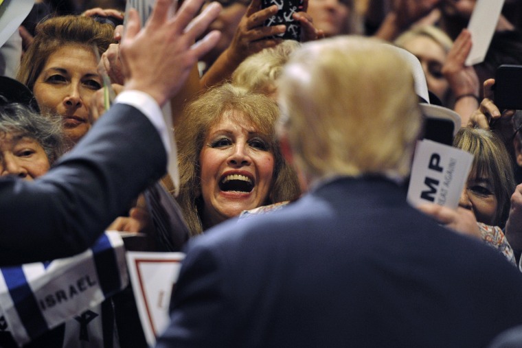 A woman gets an autograph from Donald Trump after he spoke at a campaign rally South Point Resort and Casino in Las Vegas, Nev., Jan. 21, 2016. (Photo by David Becker/Reuters)
