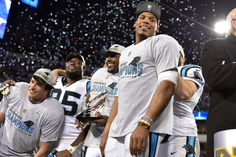 Carolina Panthers quarterback Cam Newton, right, celebrates after beating the Arizona Cardinals in the NFC Championship football game at Bank of America Stadium on Jan 24, 2016 in Charlotte, N.C. (Photo by Bob Donnan/USA Today Sports/Reuters)