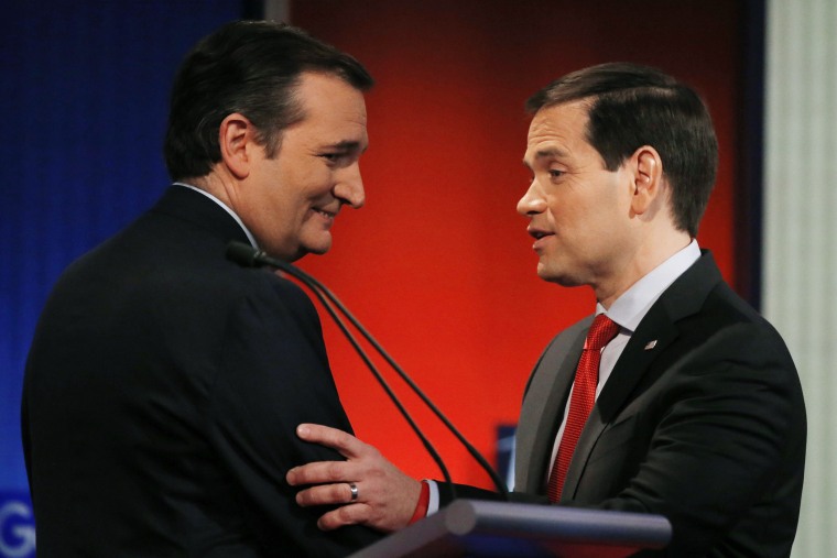 Republican presidential candidates and Senators Ted Cruz and Marco Rubio shake hands at the end of the debate held by Fox News in Des Moines, Iowa, Jan. 28, 2015. (Photo by Carlos Barria/Reuters)