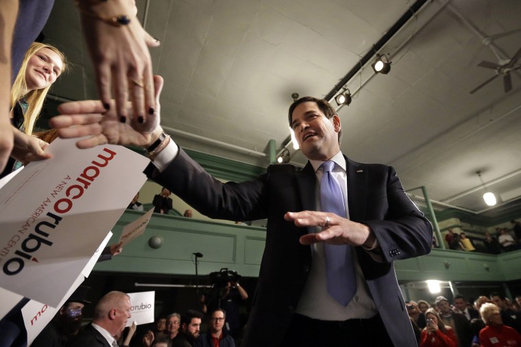 Republican presidential candidate, Sen. Marco Rubio, R-Fla., shakes hands with members of the audience at the conclusion of a campaign event, Feb. 2, 2016, in Exeter, N.H. (Photo by Steven Senne/AP)
