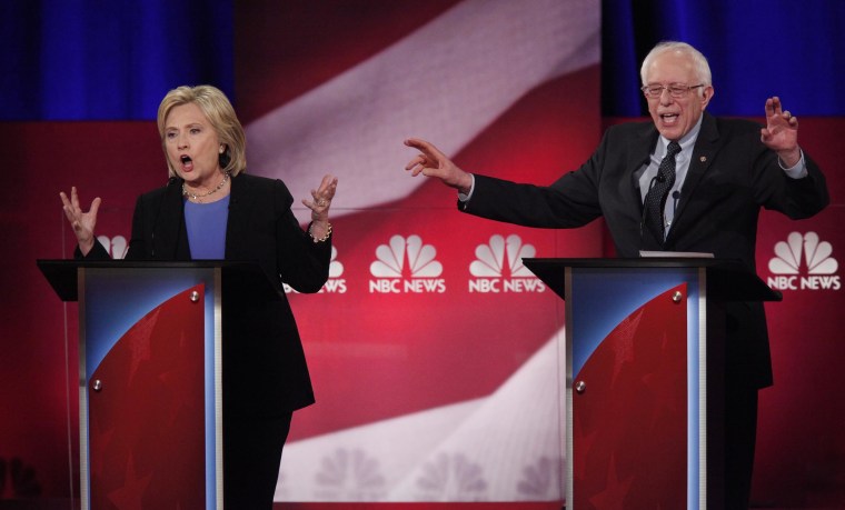 Democratic U.S. presidential candidates Hillary Clinton and Senator Bernie Sanders speak simultaneously at the NBC News - YouTube Democratic presidential candidates debate in Charleston, S.C., Jan. 17, 2016. (Photo by Randall Hill/Reuters)