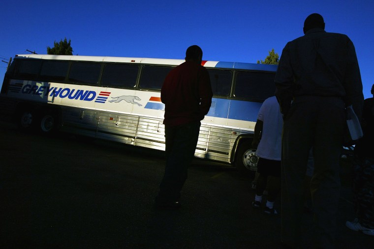 Passengers line up to board a Greyhound bus. (Photo by Spencer Platt/Fortune Magazine/Getty)