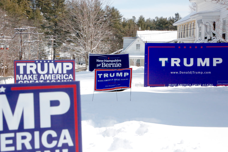 New Hampshire neighbors Don Tucker and Rick Simons are friendly rivals when it comes to yard signs. (Photo by Vaughn Hillyard/NBC News)