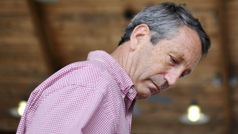 Former South Carolina Gov. Mark Sanford looks down while he browses at the Mount Pleasant Farmers Market in Mount Pleasant, S.C., May 7, 2013. (Photo by Rainier Ehrhardt/AP)