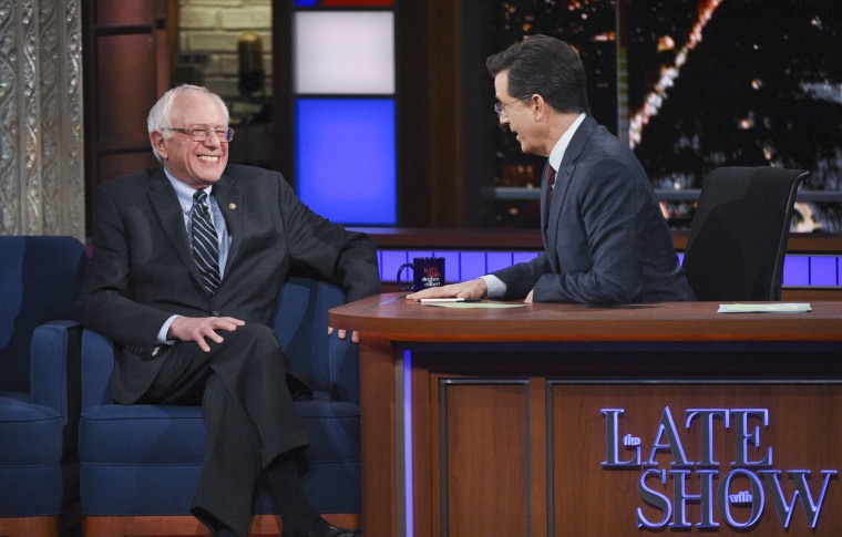 This image released by CBS shows Democratic presidential candidate Sen. Bernie Sanders, of Vermont, with host Stephen Colbert during a taping of \"The Late Show with Stephen Colbert,\" Feb. 10, 2016, in New York. (Photo by Jeffrey R. Staab/CBS/AP)