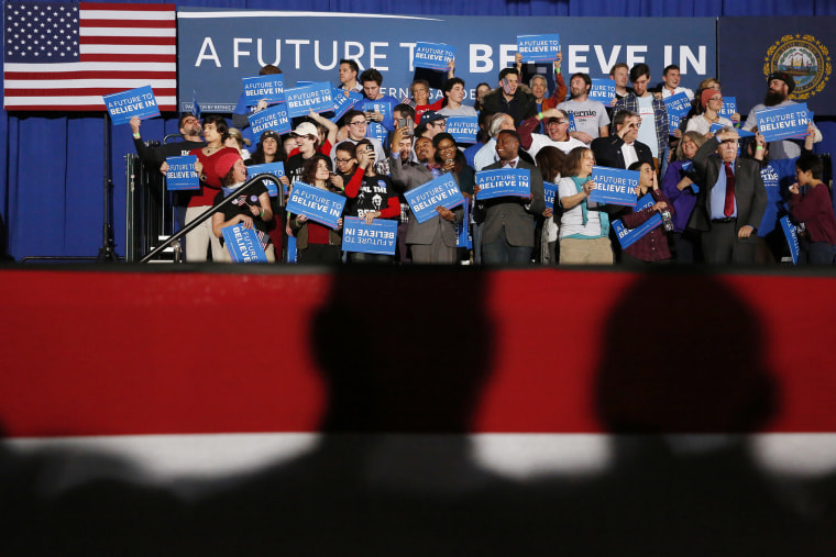 Shadows loom over supporters of Democratic presidential candidate Bernie Sanders at his 2016 New Hampshire presidential primary night rally in Concord, N.H., Feb. 9, 2016. (Photo by Shannon Stapleton/Reuters)