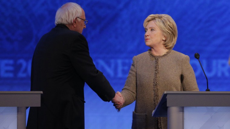 Democratic presidential candidate Senator Bernie Sanders shakes hands with rival Hillary Clinton at the conclusion of the Democratic presidential candidates debate at St. Anselm College in Manchester, N.H., Dec. 19, 2015. (Photo by Brian Snyder/Reuters)