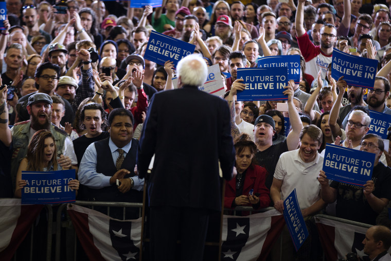 People cheer for Democratic presidential candidate Sen. Bernie Sanders (I-Vt.) as he speaks during a rally at Bonanza High School, Feb. 14, 2016, in Las Vegas. (Photo by Evan Vucci/AP)