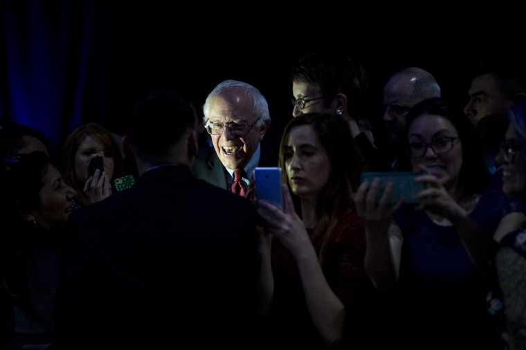 Presidential candidate Bernie Sanders poses for selfies with supporters after speaking during the Clark County Democratic Party Kick Off to Caucus Dinner at the Tropicana in Las Vegas, Nev., Feb. 18, 2016. (Photo By Bill Clark/CQ Roll Call/Getty)