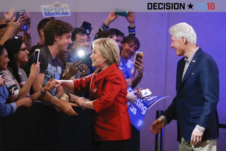 Democratic presidential candidate Hillary Clinton greets supporters with her husband and former President Bill Clinton at a Nevada Democratic caucus rally on Feb. 20, 2016, in Las Vegas, Nev. (Photo by John Locher/AP)