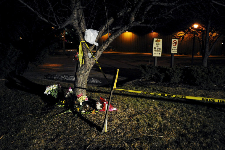 Flowers are placed at a makeshift memorial near a Cracker Barrel restaurant, one of the sites of a series of random shootings that killed six people in Kalamazoo County, Mich., on Feb. 21, 2016. (Photo by Mark Kauzlarich/Reuters)