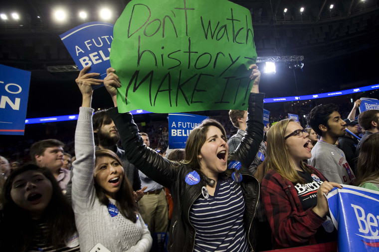 Supporters of Democratic presidential candidate Sen. Bernie Sanders, I-Vt., cheer during a rally, Feb. 21, 2016, in Greenville, S.C. (Photo by John Bazemore/AP)