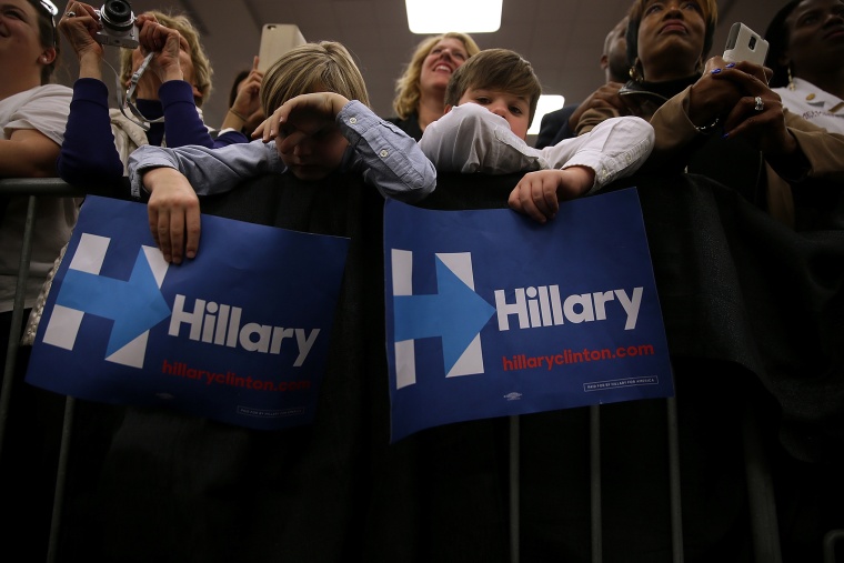 Young supporters hold signs as Hillary Clinton speaks during a \"Get Out The Vote\" event at Meharry Medical College on Feb. 28, 2016 in Nashville, Tenn. (Photo by Justin Sullivan/Getty)