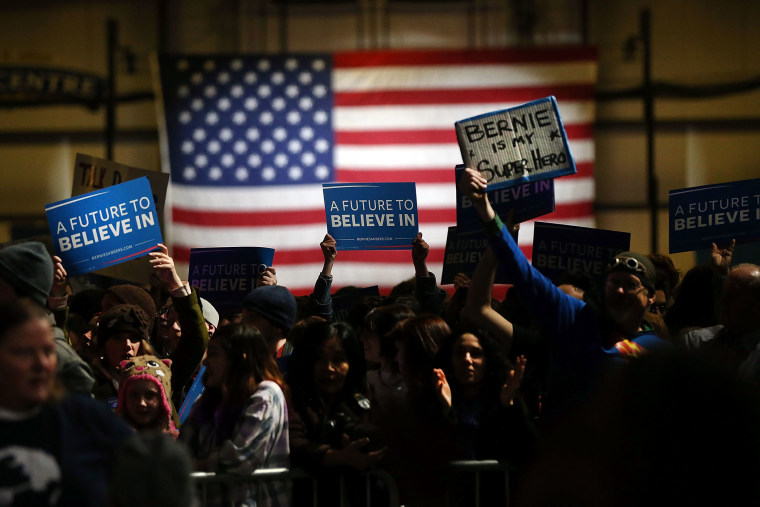 Supporters of Democratic presidential candidate, Sen. Bernie Sanders (D-VT) wait for his arrival on stage at the Champlain Valley Exposition March 1, 2016 in Essex Junction, Vt. (Photo by Spencer Platt/Getty)
