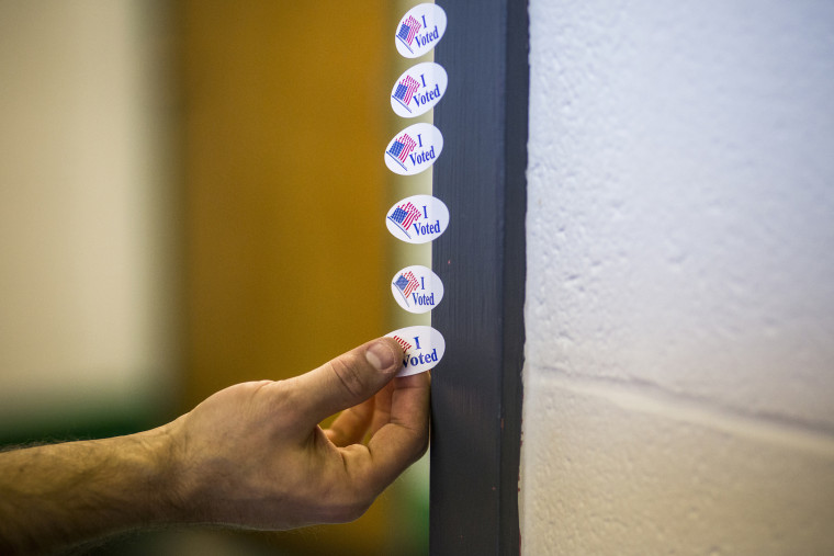 A voter takes an \"I Voted\" sticker after casting their ballot at the Shelby Park Community Center, a polling station in Nashville, Tenn., March 1, 2016. (Photo by Joe Buglewicz/The New York Times/Redux)
