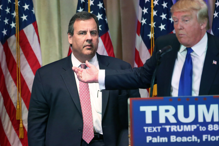 New Jersey Governor Chris Christie accompanies Republican Presidential frontrunner Donald Trump off the stage after a press conference on March 1, 2016 in Palm Beach, Fla. (Photo by John Moore/Getty)